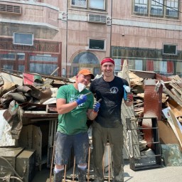 Two Main Streeters work to clean up after a disaster downtown.