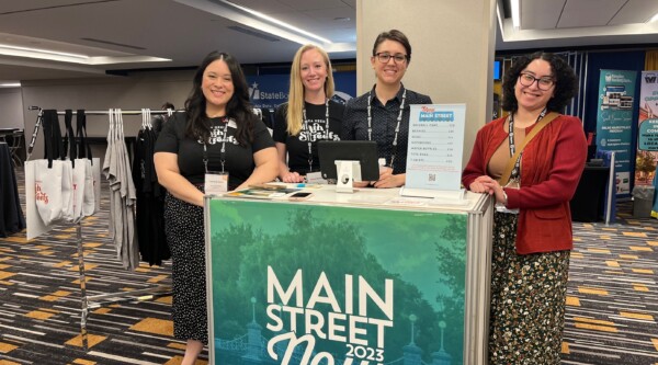 Staff members at the exhibitor hall at the Main Street Now Conference.