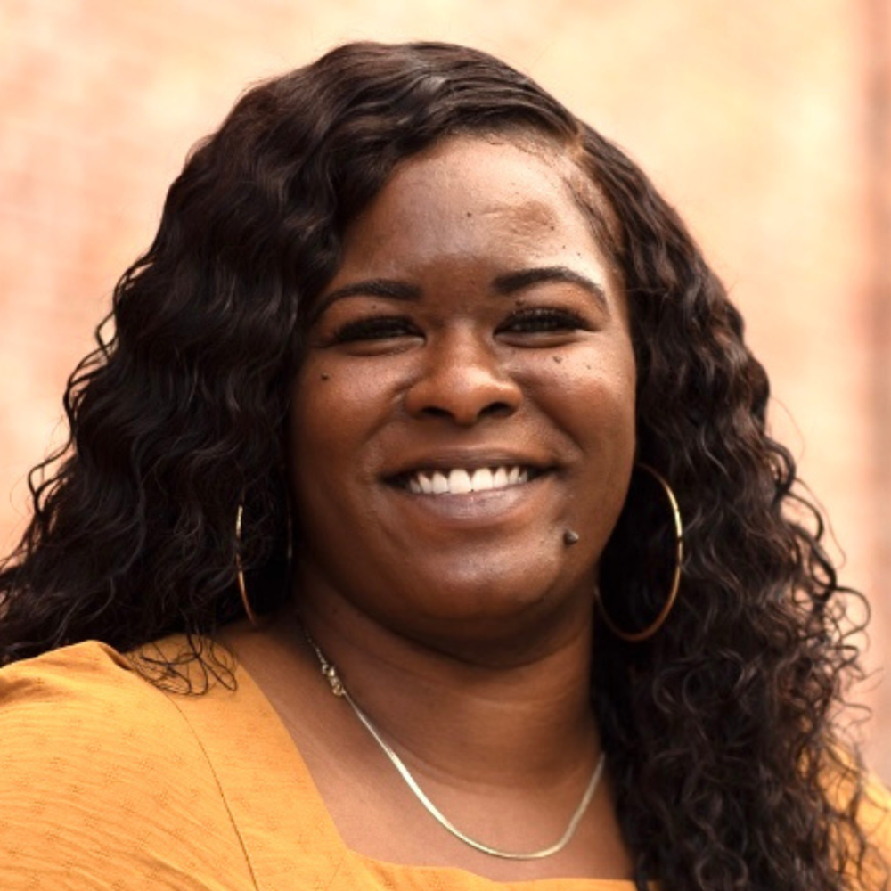 Woman with yellow shirt smiling