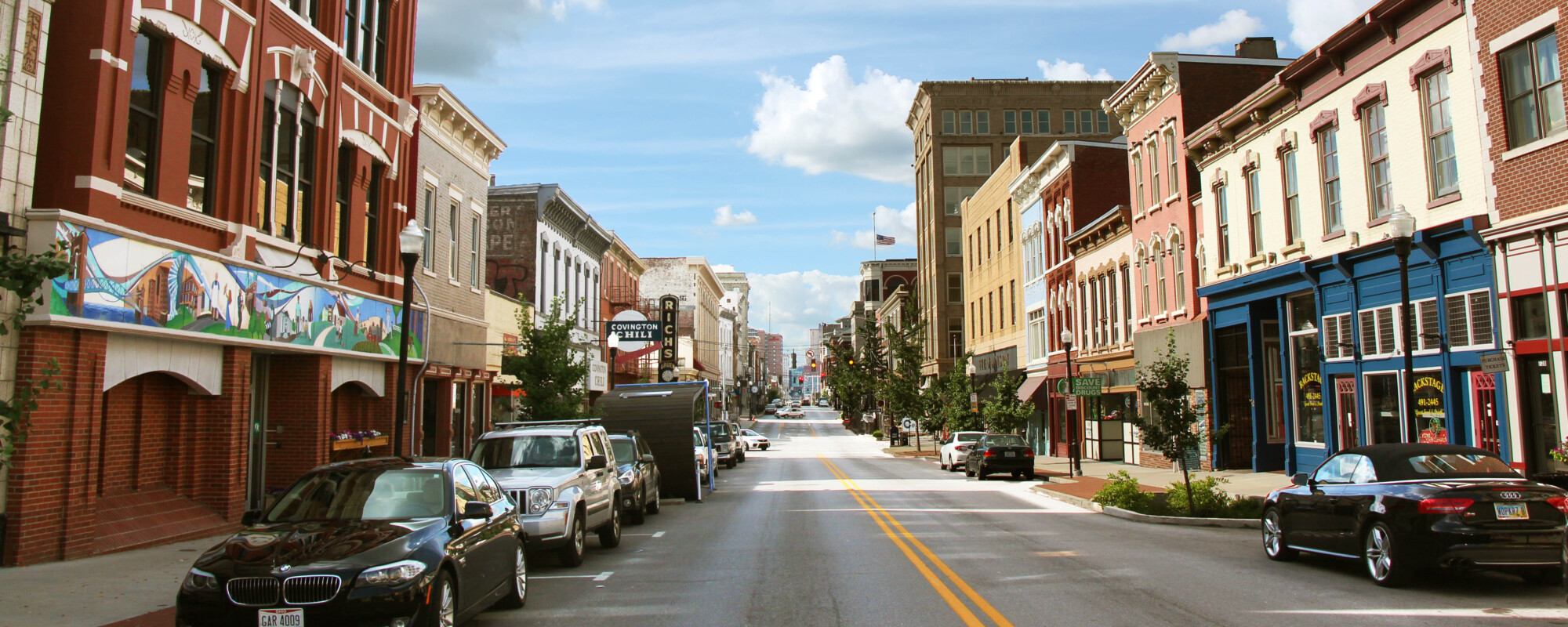 Street view of a two-way street with historic buildings on both sides.