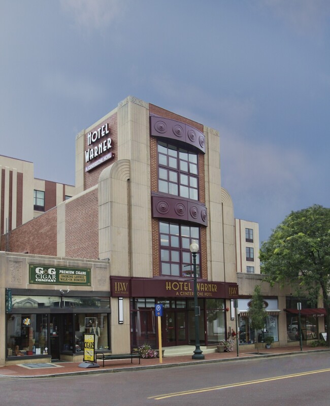 Exterior façade of a mid-century modern hotel.