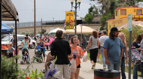 Shoppers stroll between pop-up booths.
