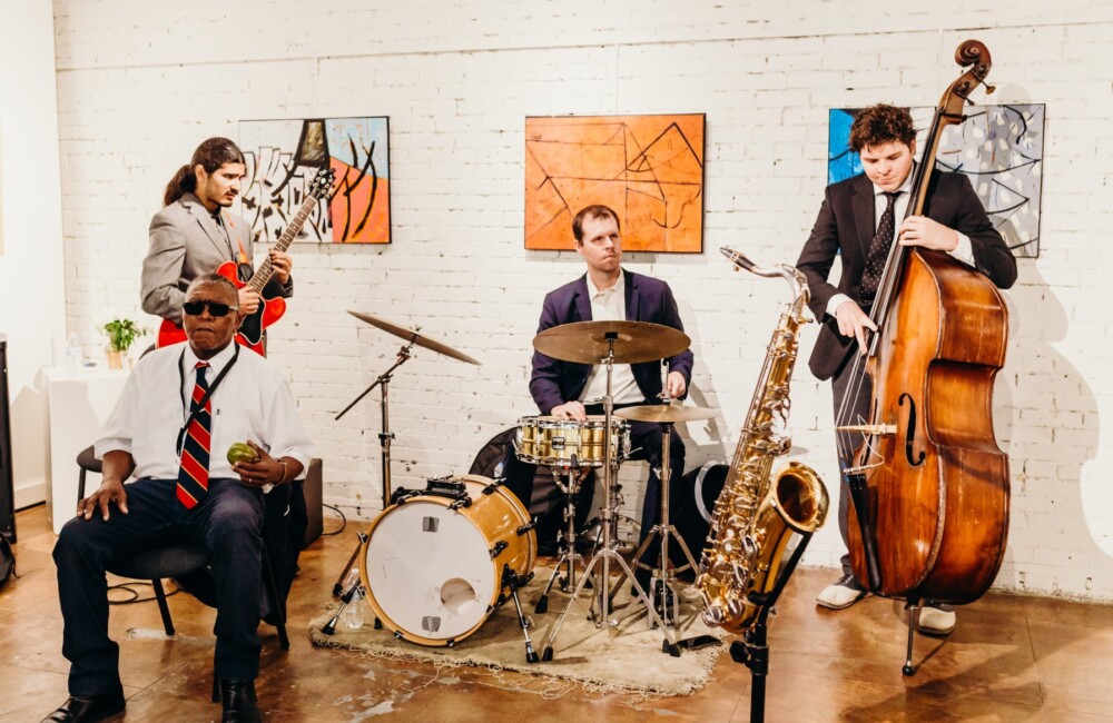 A jazz quartet performed in an art gallery space.