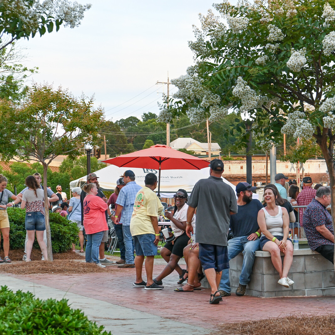 People gather in a plaza to socialize.