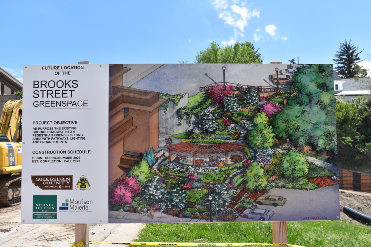 Sign featuring an artist rendering of a green space revitalization project.