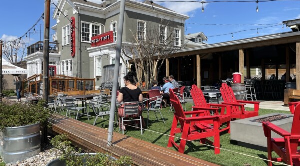 Parklet-style outdoor restaurant seating area.