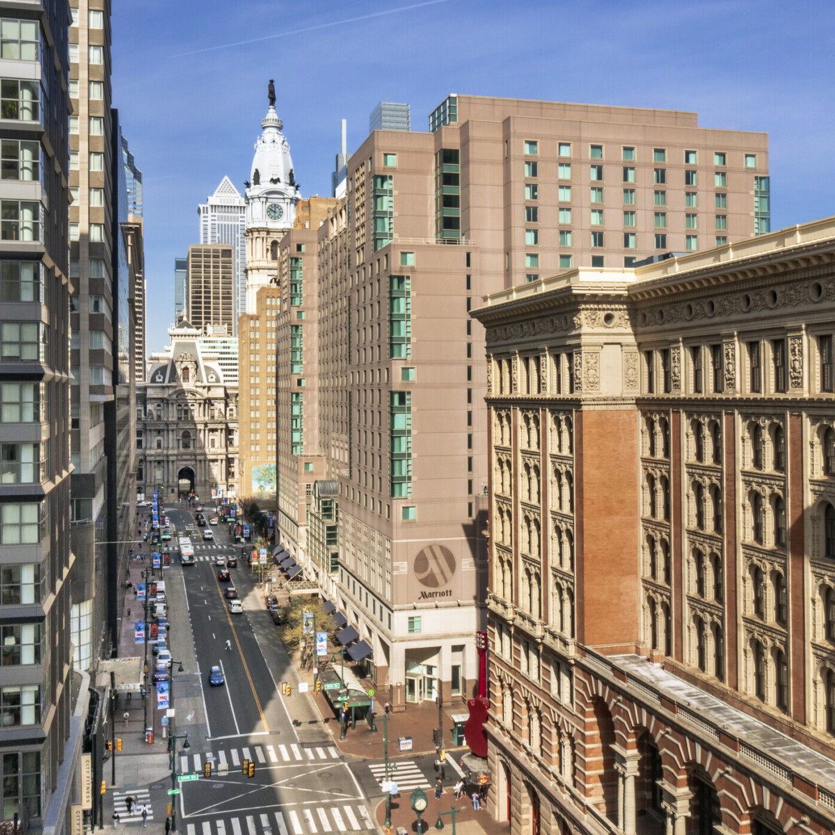 Rooftop view of Philadelphia City Center where tall buildings line a broad street.