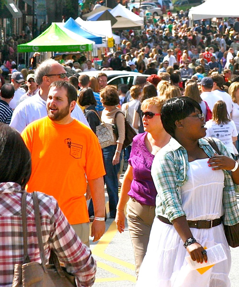 People walking at a downtown street festival