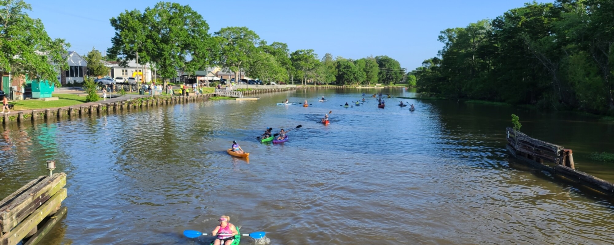 People kayaking along a river