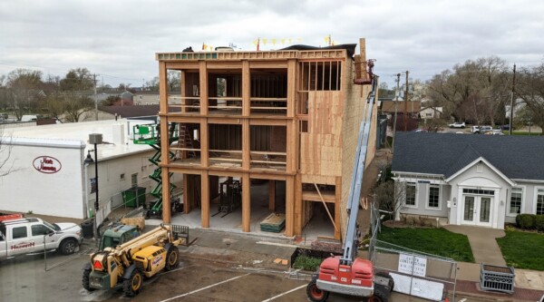 A small multi-family building during the framing process of construction