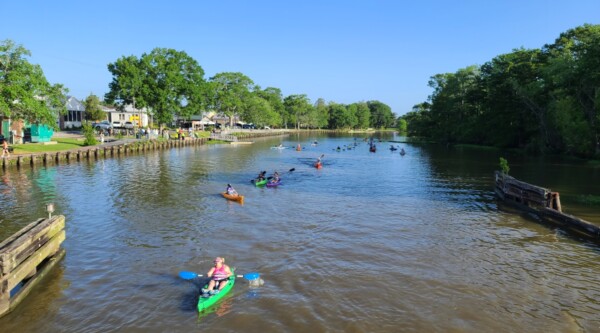 People kayaking along a river
