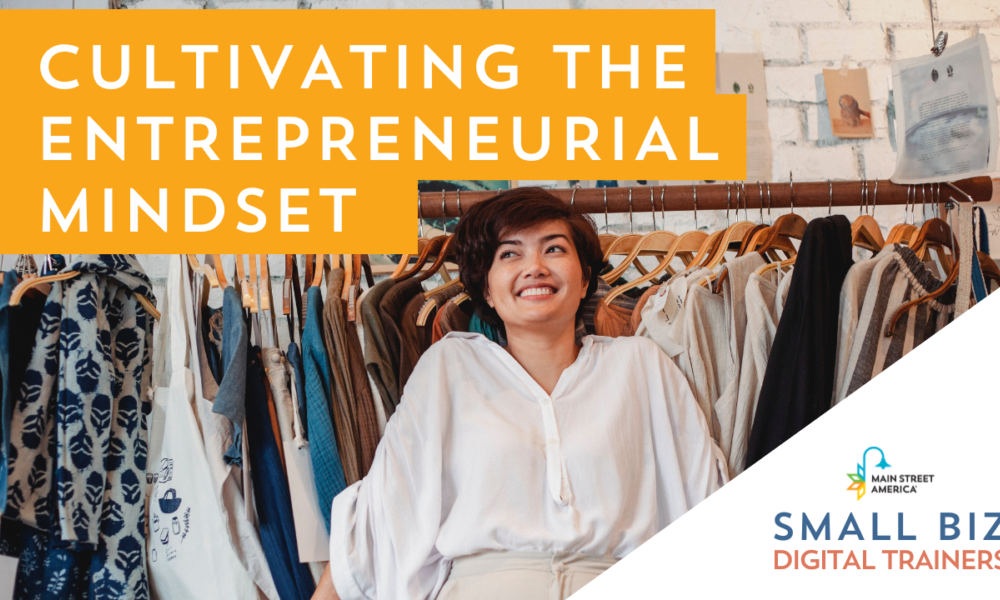 Smiling woman wearing white shirt stands in front of clothing rack at small business. Words in front of image read, "Cultivating the Entrepreneurial Mindset" with Main Street America logo above words, "Small Biz Digital Trainers."