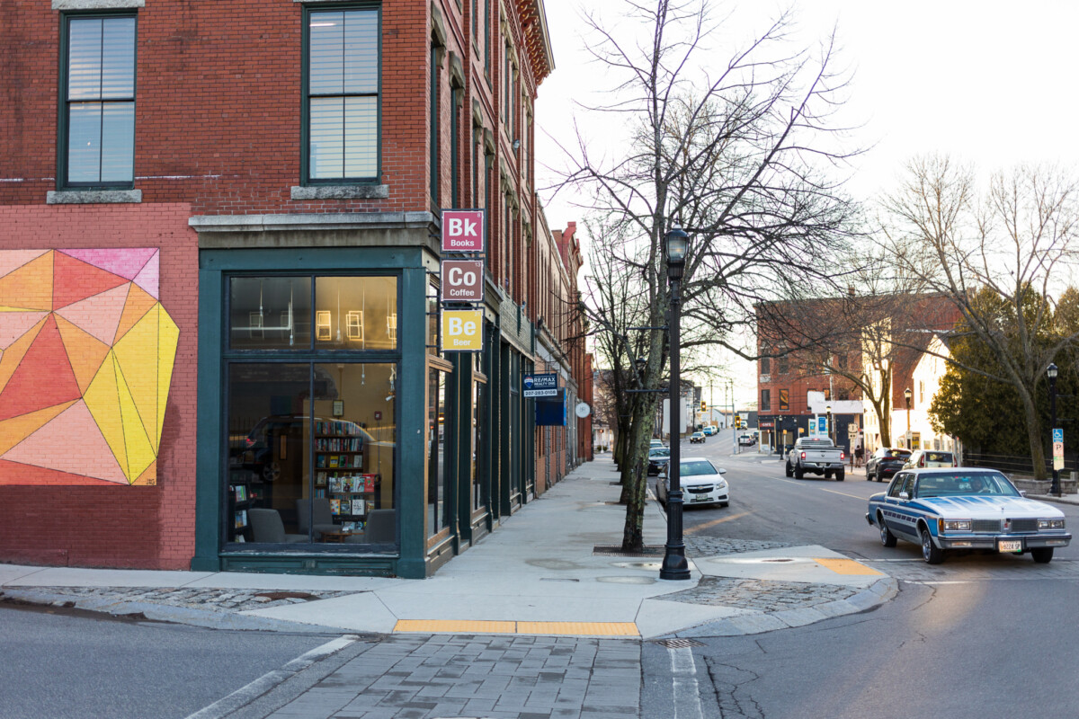 Downtown street with red brick buildings and trees