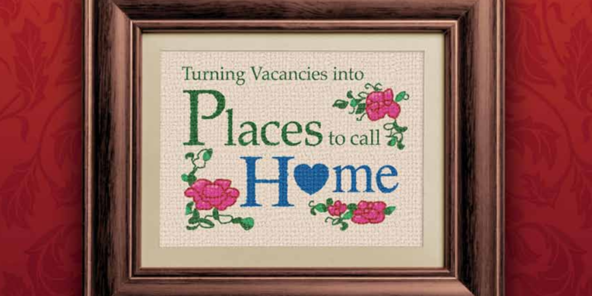 A graphic that looks like old cross-stitch art and reads "turning vacancies into places to call home"