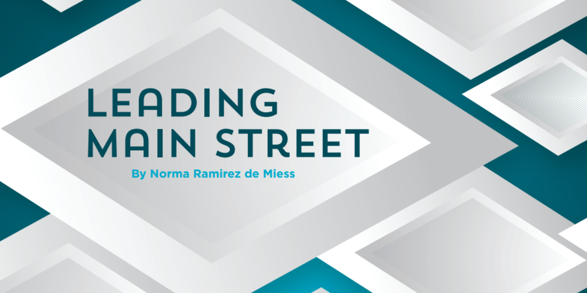 Graphic featuring overlapping white diamonds on a blue background. Text reads "leading main street"