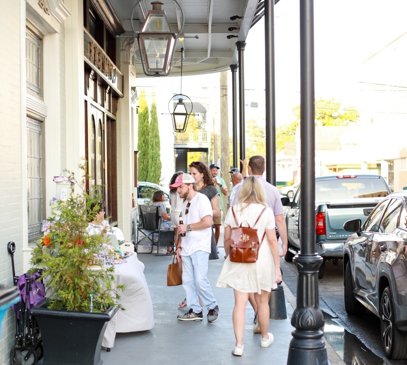 People walk under historic balconies in downtown Thibodaux, LA