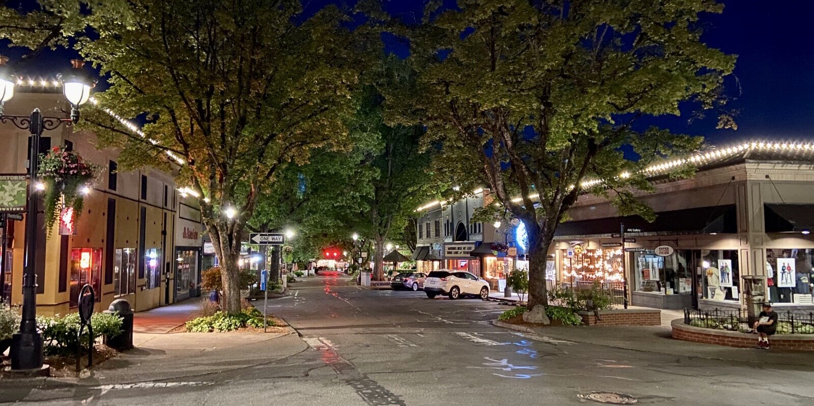 Camas, Washington at night with roofline lighting and outdoor dining