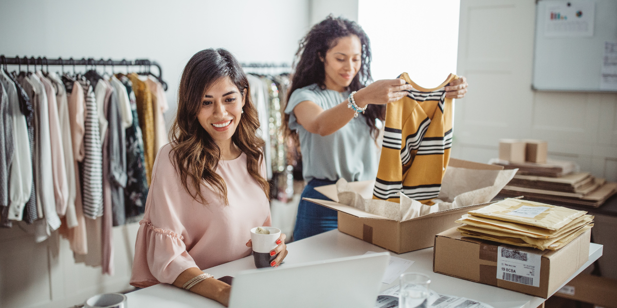 Two women reviewing inventory in a small business