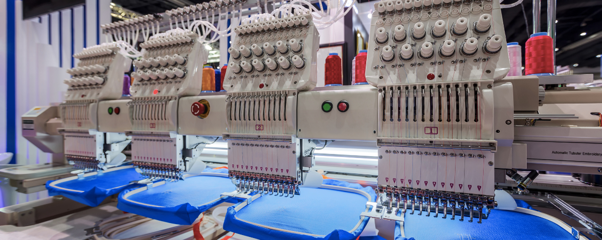 A line of industrial embroidery machines