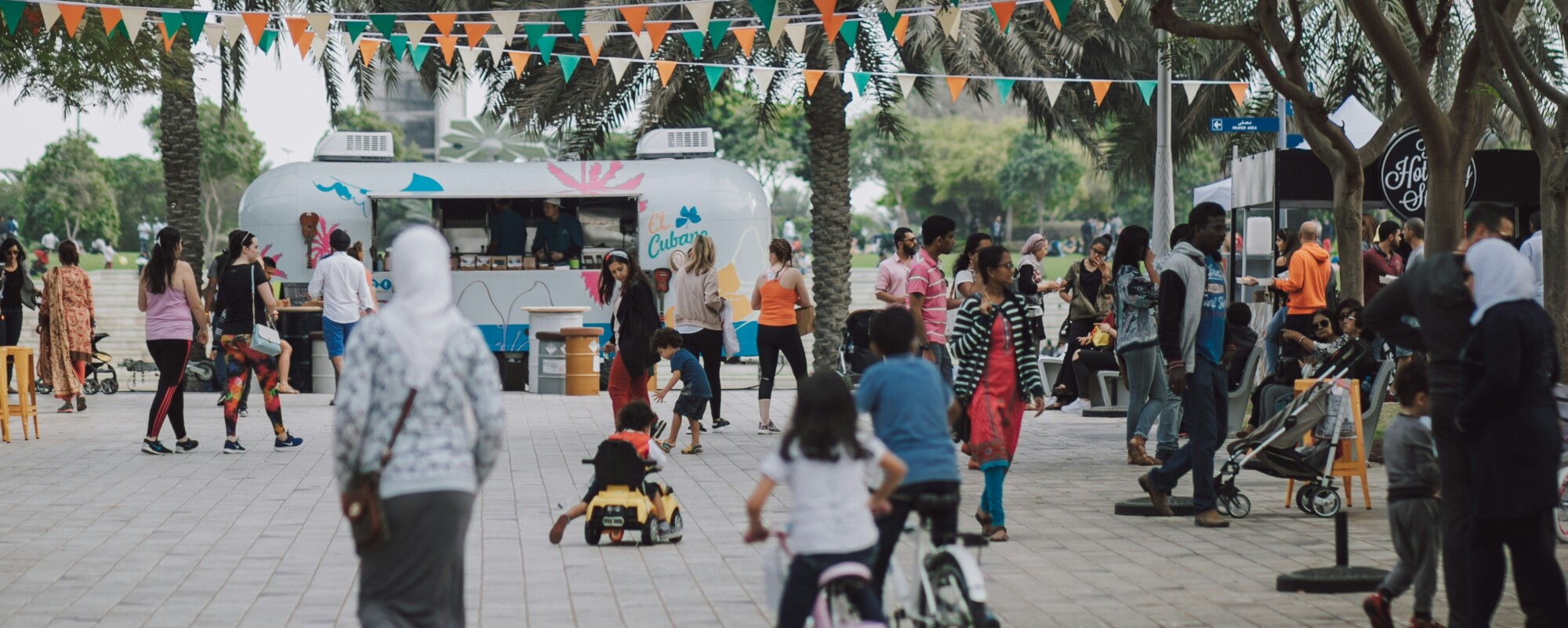 A downtown event with food tricks and colorful decorations