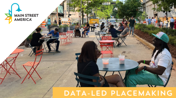 People sitting at tables in an street-turned-outdoor-gathering area. Overlaid text reads "Data-Led Placemaking"