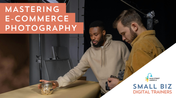 One man positions a jar on a table while another man holds a camera pointed toward the jar. Over the image, text reads, "Mastering e-commerce photography," with the Main Street America logo over the words, "Small Biz Digital Trainers."