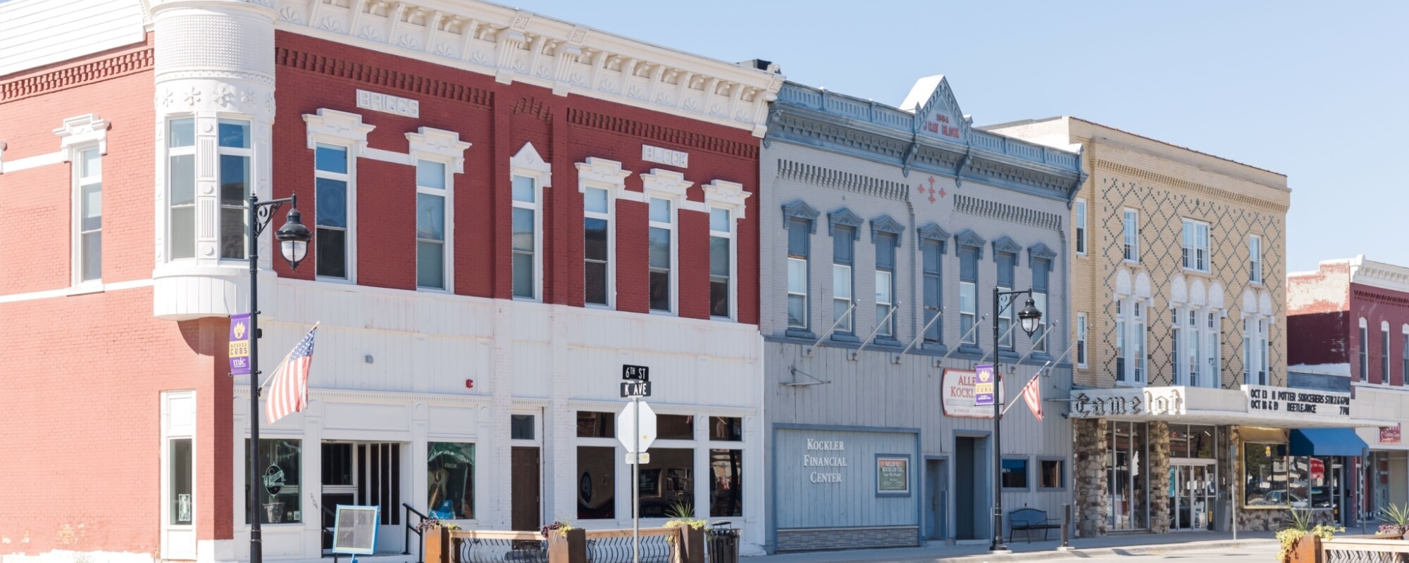 Historic buildings line a commercial district street.