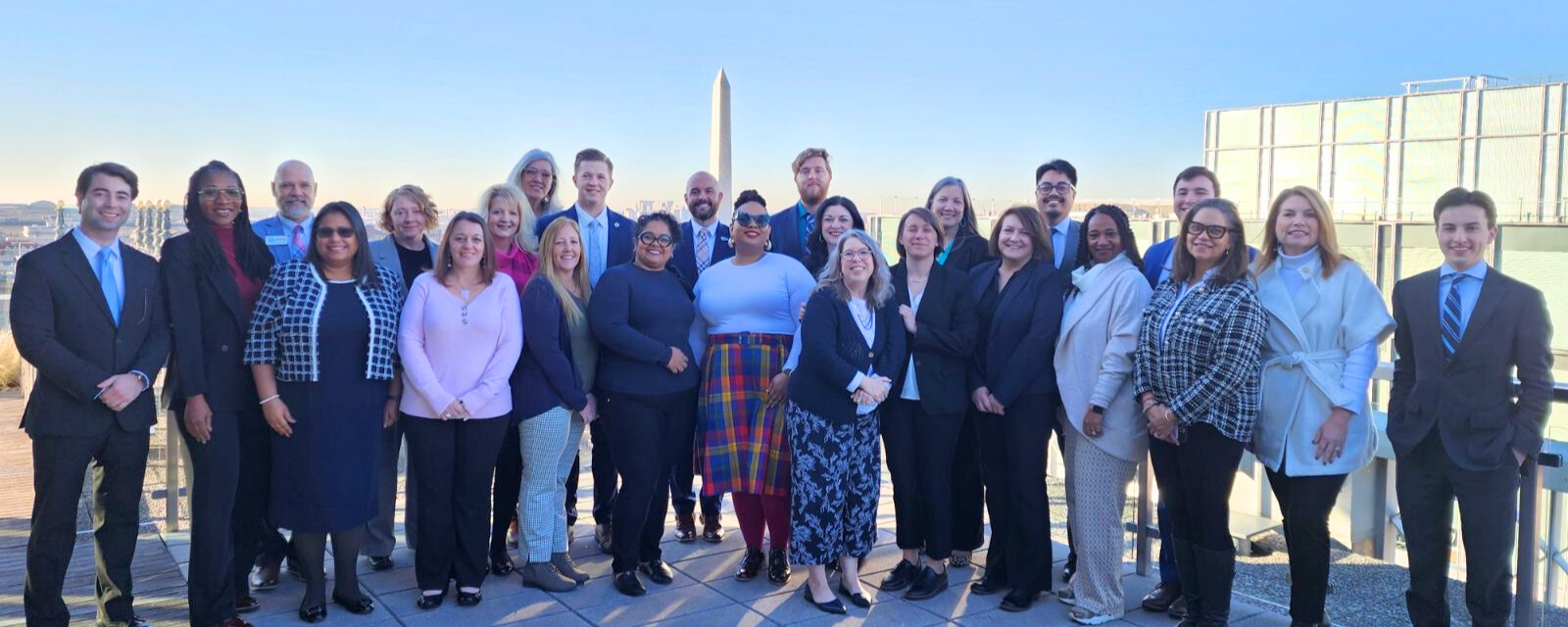 Main Street leaders pose in front of the Washington Monument