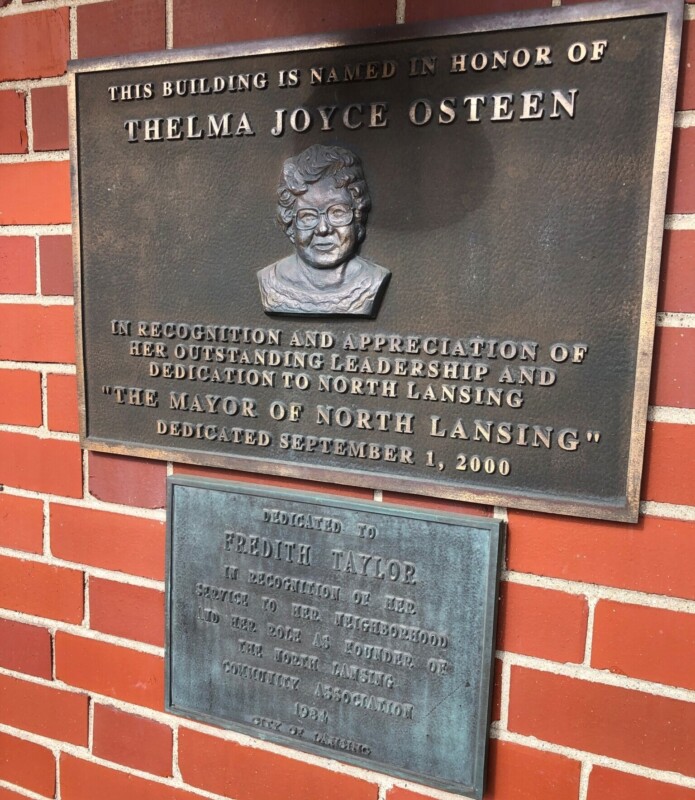 A plaque on a brick wall honoring Thelma Joyce Osteen