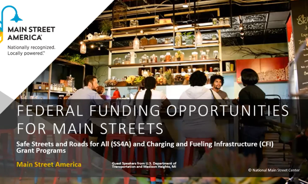 Welcome screen for the DOT funding opportunities webinar. Text reads "Federal Funding Opportunities for Main Streets: Safe Streets and Roads for All and Charging and Fueling Infrastructure Grant Program" with the Main Street America logo