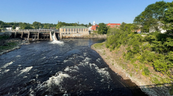 A river lined by historic mill buildings