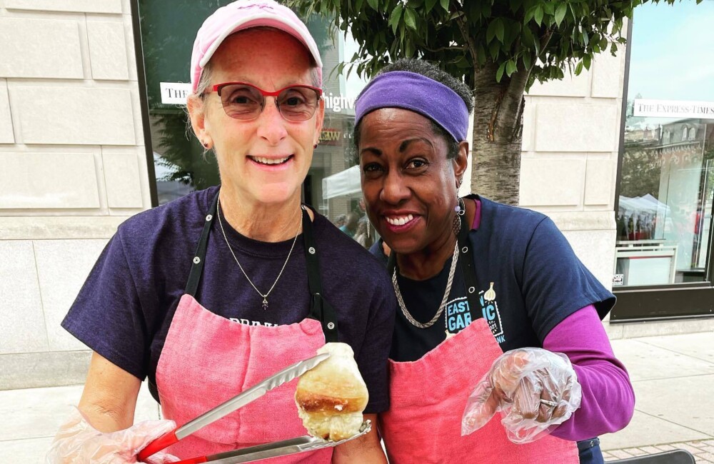 Jill and Darcel ready to serve hot, fresh, delicious garlic knots at our annual fundraiser during Easton Garlic Fest.