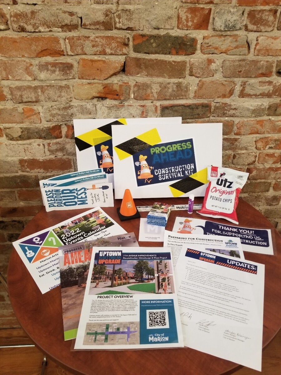 Pamphlets, handouts, and other paper materials providing updates on an ongoing construction project