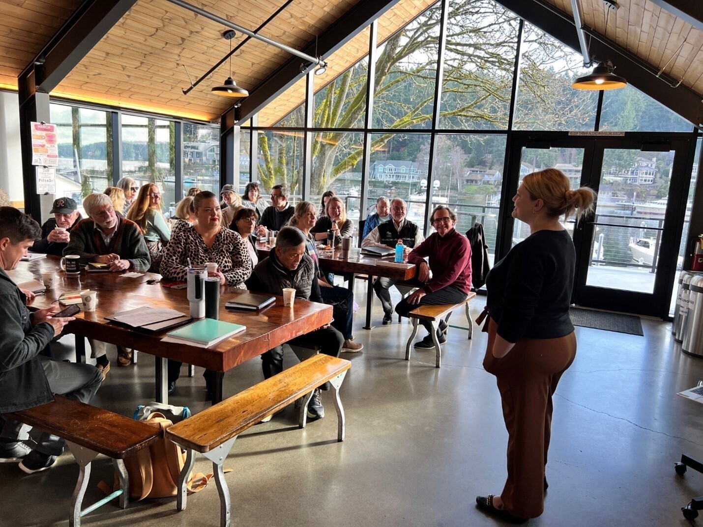 Jackie Swihart addresses tables full of participants during a workshop