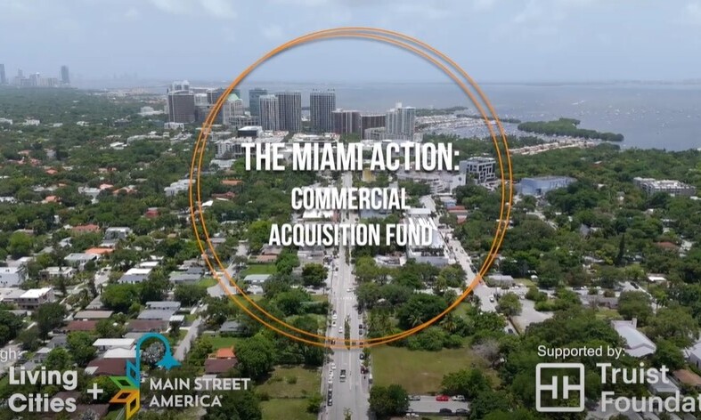 Aerial shot of downtown Miami, Florida, with words overlaid reading, "The Miami Action: Commercial Acquisition Fund," and logos for Living Cities, Main Street America, and Truist Foundation