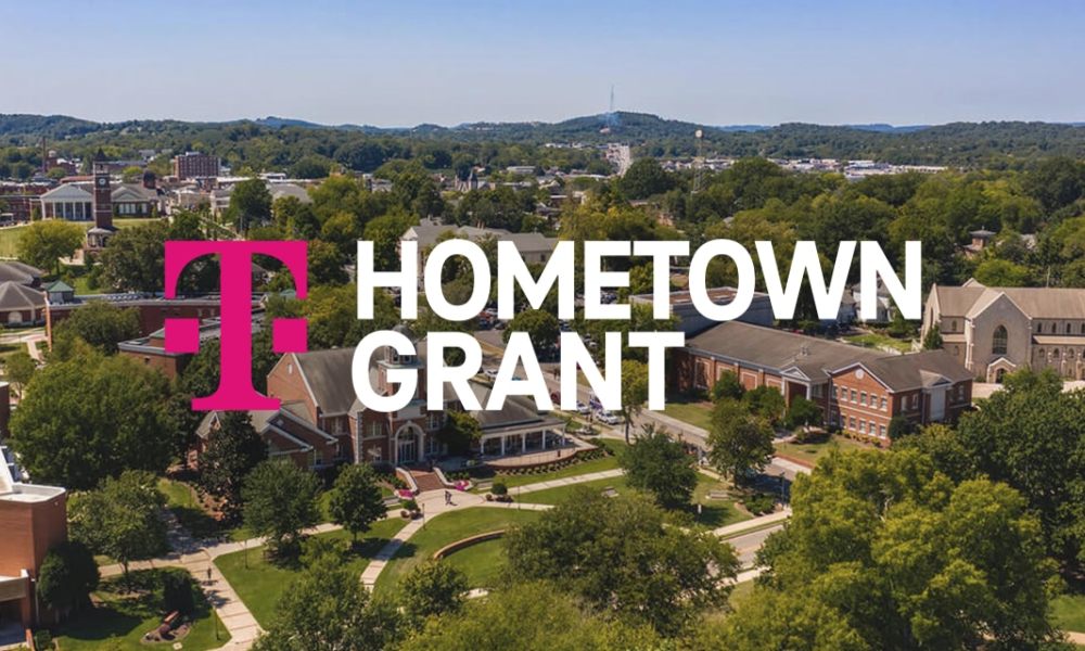 Aerial photo of small town with words overlaid reading, "Hometown Grant" with the T-Mobile logo.