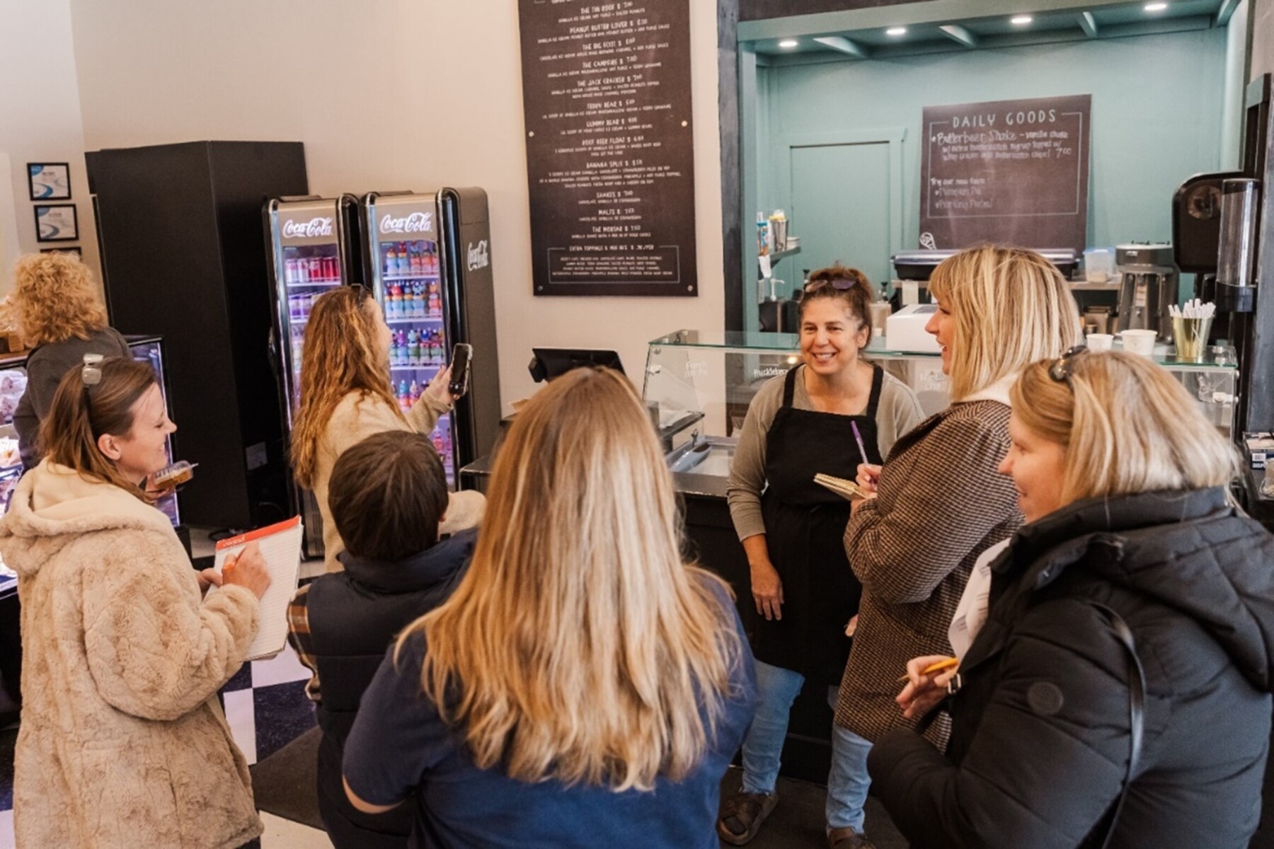 A group of people touring a downtown bakery