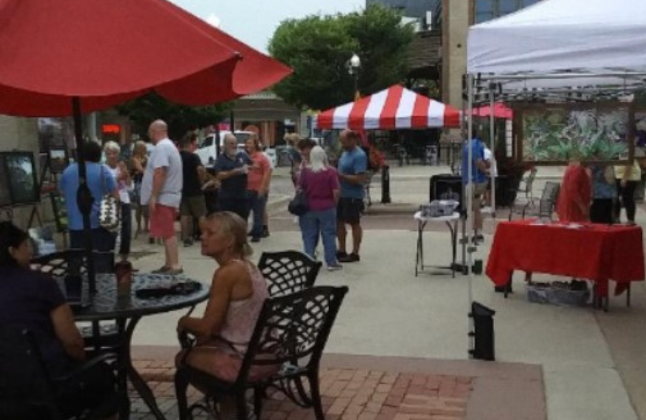 Pedestrian area with lots of people and outdoor tents