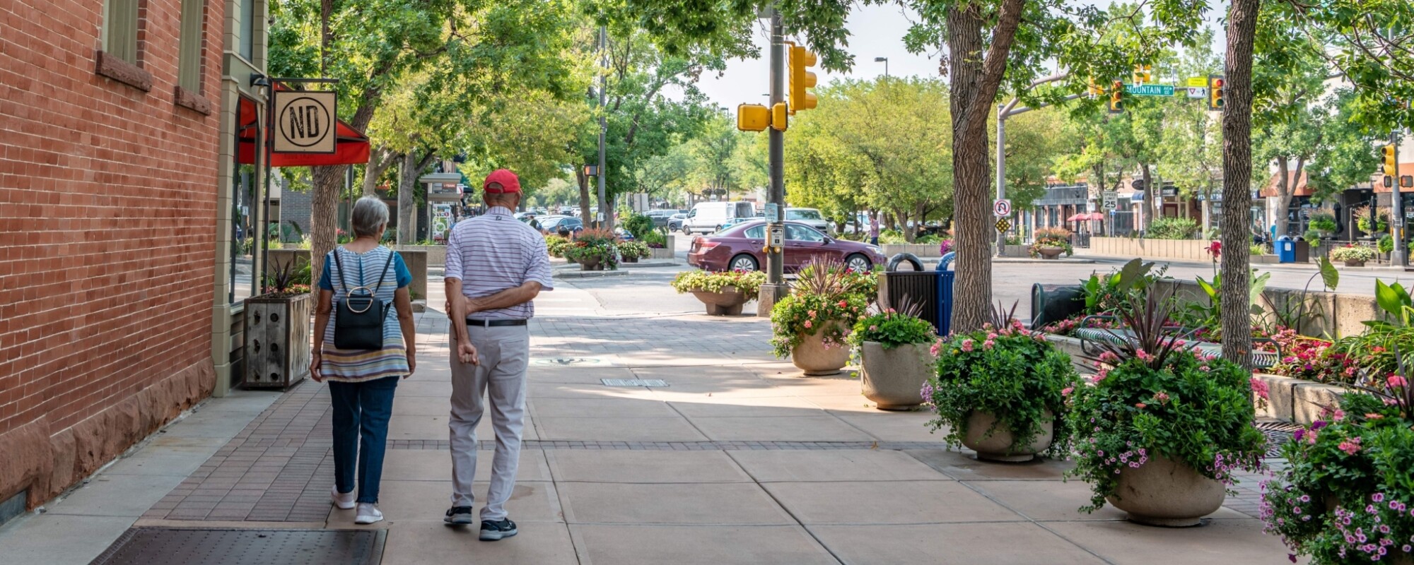 An elderly couple exploring a beautiful historic downtown