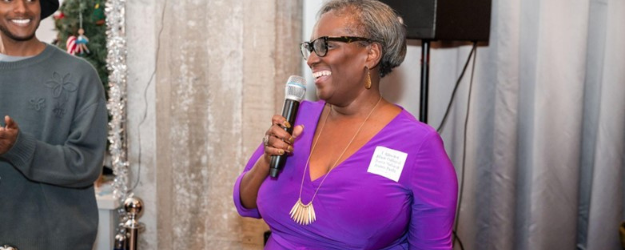 Carolyn Johnson speaking into a microphone