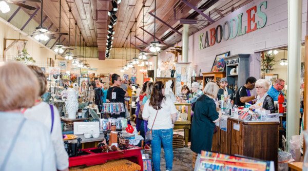 People shopping for artisanal goods in an eclectic local shop