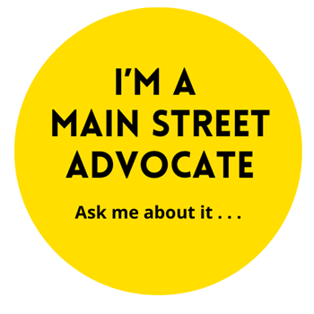 Yellow circle with the words "I'm a Main Street Advocate, ask me about it"