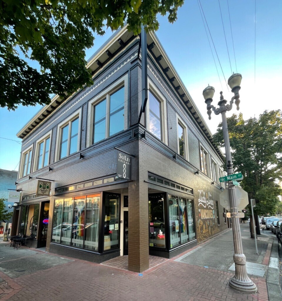 Historic corner building with gray walls