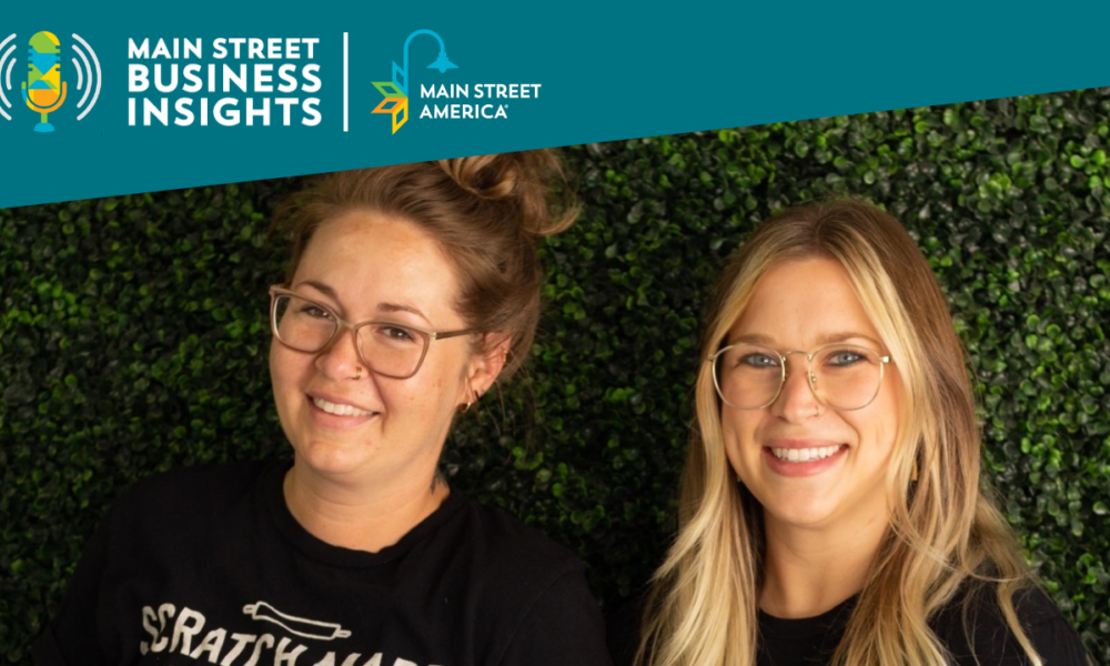 Two smiling women wearing black t-shirts reading, "Scratch Made Bakery."