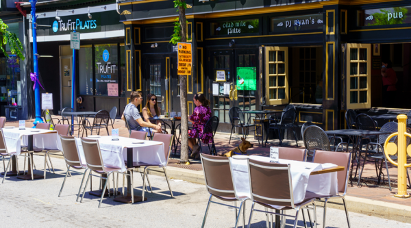 Outdoor dining tables on a city street