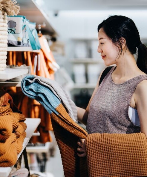 Woman in a store shopping for apparel
