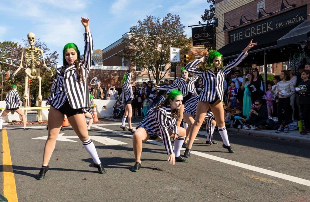 Women dressed up as Beetlejuice performing a choreographed dance