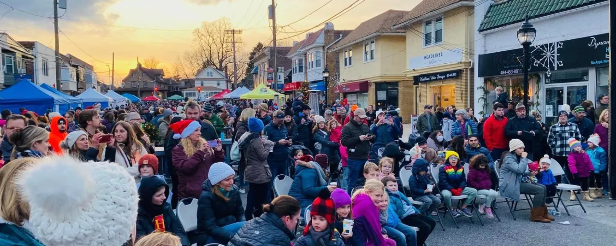 A crowd of people on a downtown street in winter