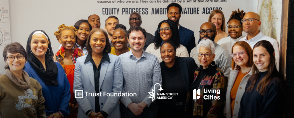 Breaking Barriers to Business (B3) team and stakeholders smiling at camera in building in Atlanta, Georgia