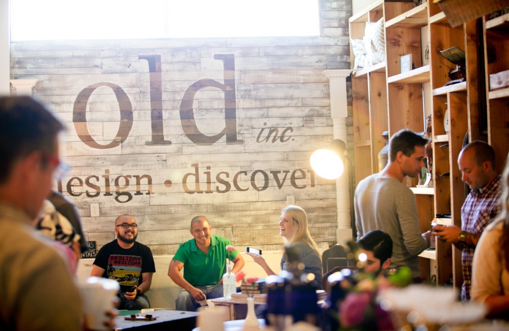 People gather in an indoors communal seating area.